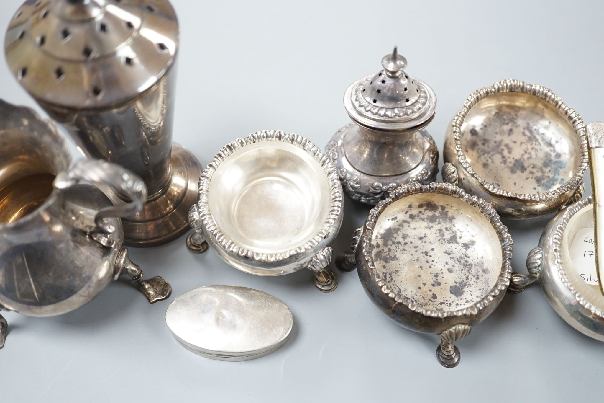 Sundry silver including four Georgian salts, and Art Deco sugar caster, cream jug, condiment and fruit knife.